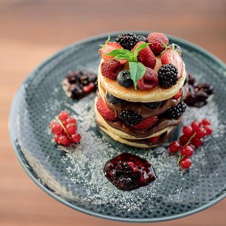 Address Istanbul Hotel Ngoại thất bức ảnh A stack of pancakes with fruit